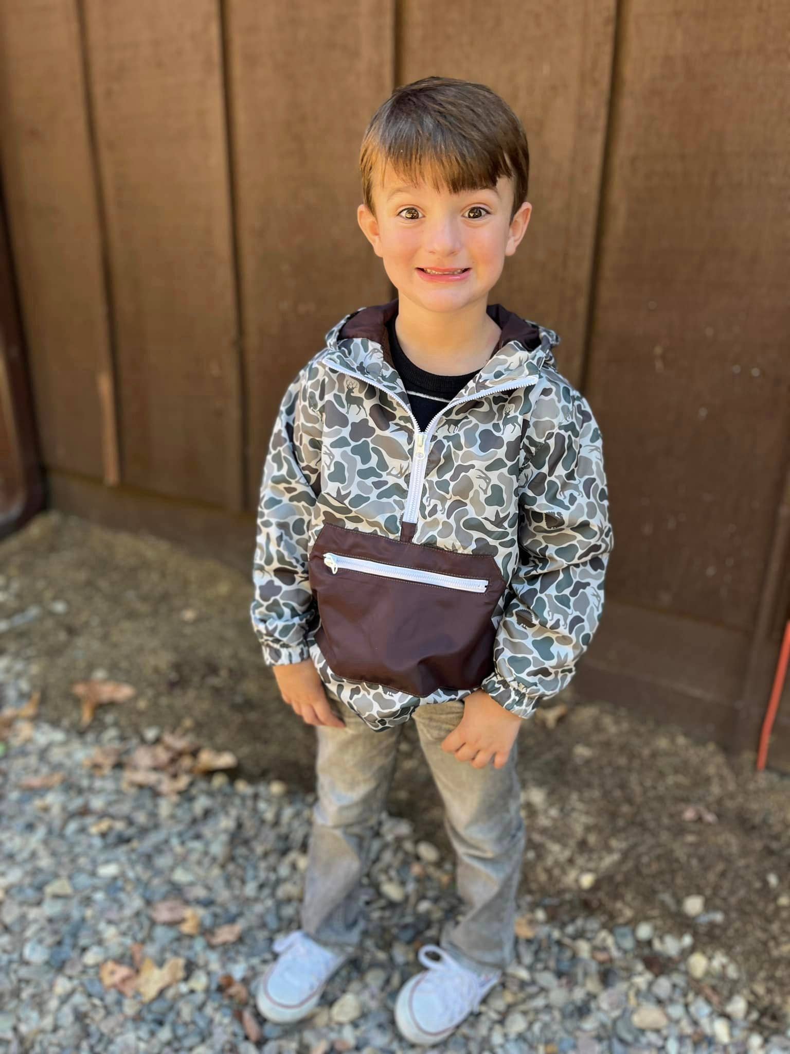 An application scenario or product detail of boys camo rain jacket - Image 4