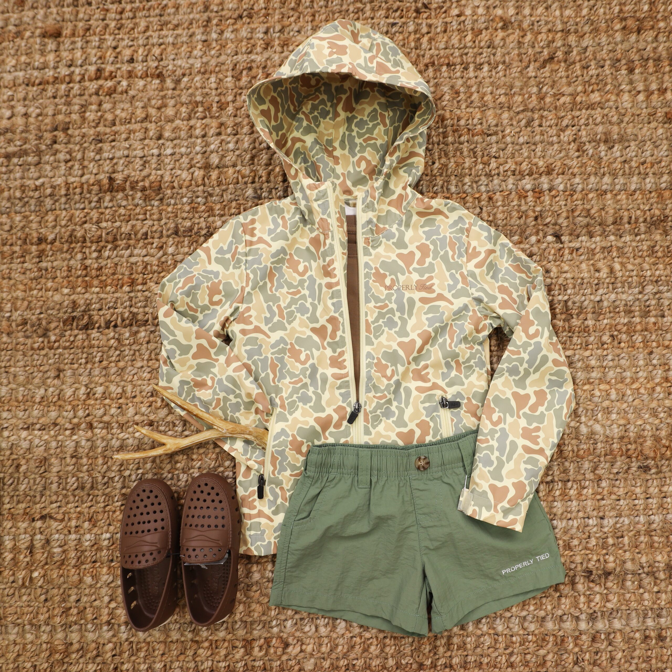 An application scenario or product detail of boys camo rain jacket - Image 13