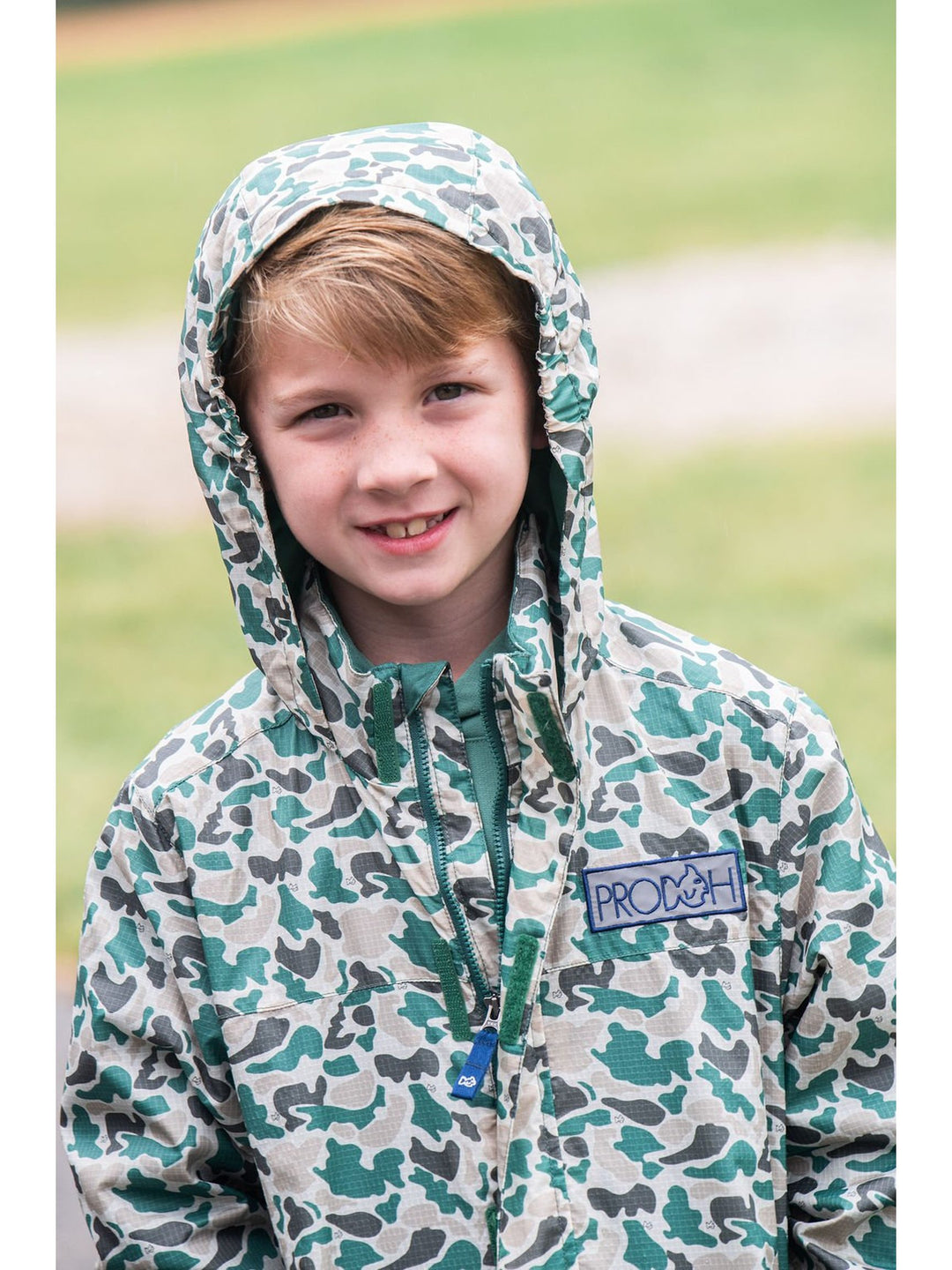 An application scenario or product detail of boys camo rain jacket - Image 19